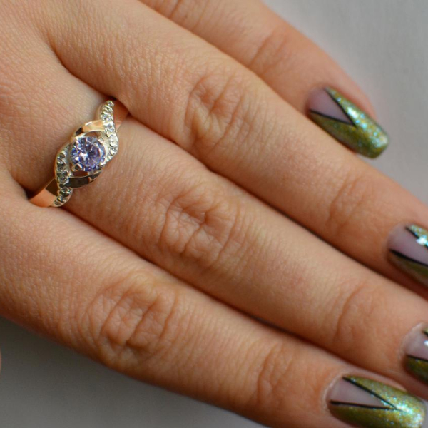 Серебряное кольцо с золотыми вставками