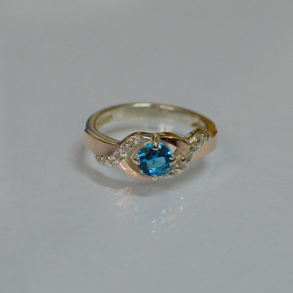 Серебряное кольцо с золотыми вставками