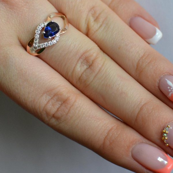 Срібна каблучка з золотими вставками