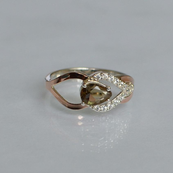 Срібна каблучка з золотими вставками