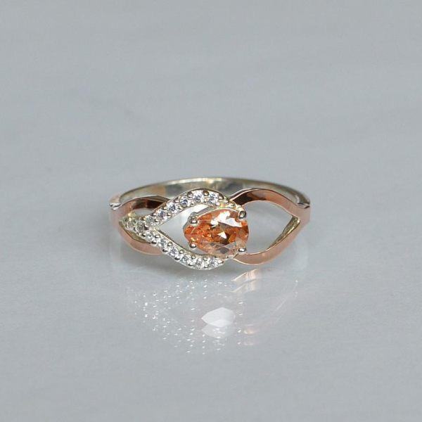 Срібна каблучка з золотими вставками