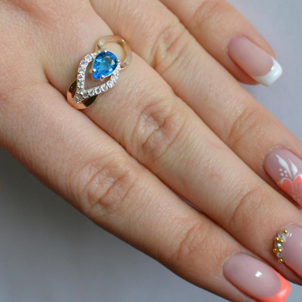 Срібна каблучка з золотими вставками