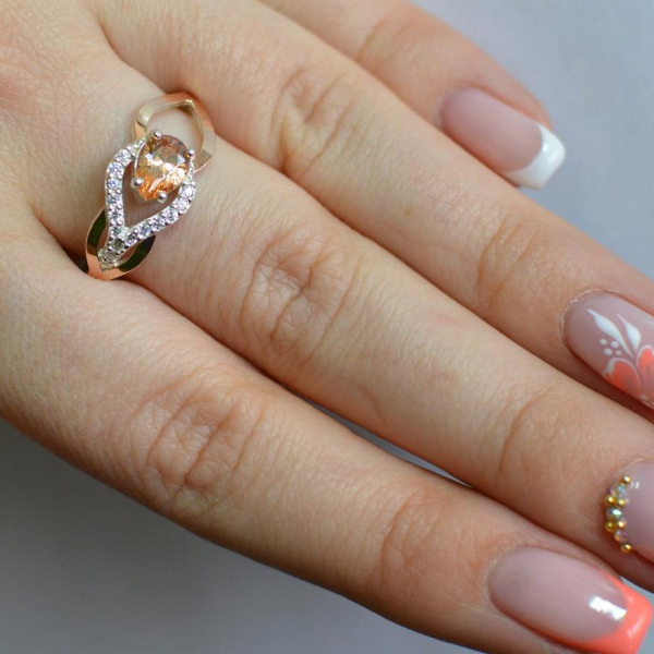 Срібна каблучка з золотими вставками