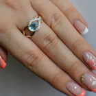 Срібна каблучка з золотими вставками