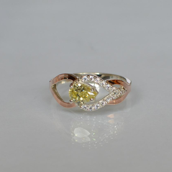 Срібна каблучка з золотими вставками