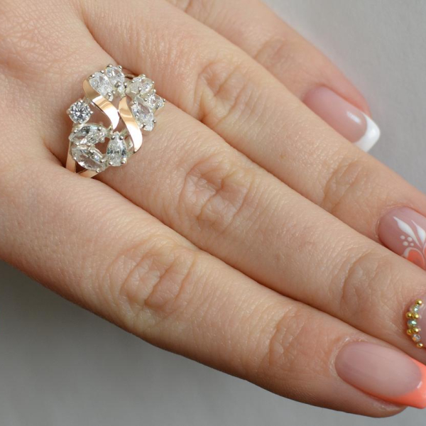 Срібна каблучка з золотими вставками