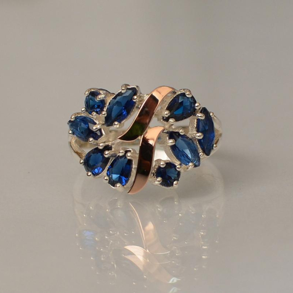 Срібна каблучка з золотими вставками