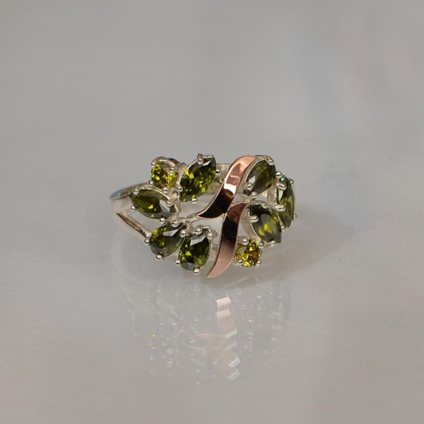 Срібна каблучка з золотими вставками