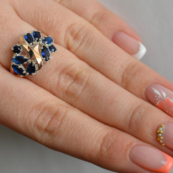 Срібна каблучка з золотими вставками