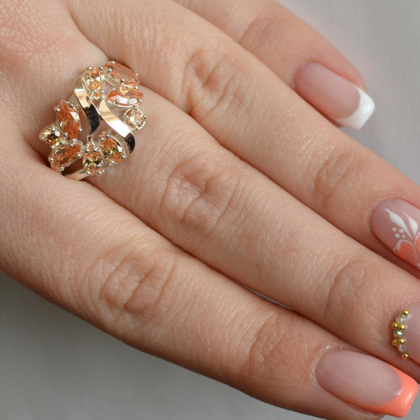 Срібна каблучка з золотими вставками