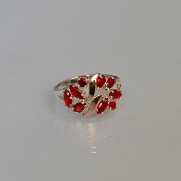 Срібна каблучка з золотими вставками