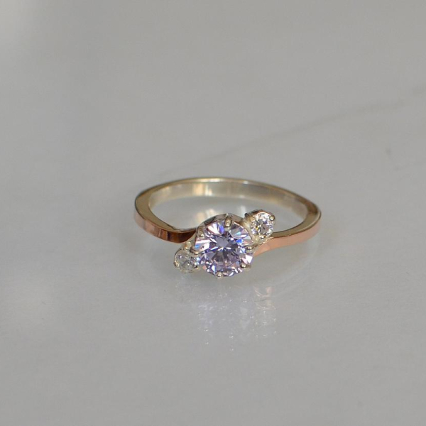 Срібна каблучка з золотими вставками