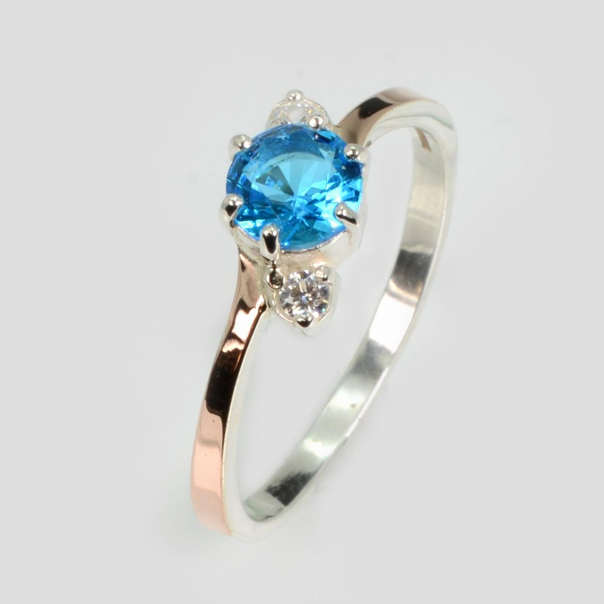 Срібна каблучка з золотими вставками