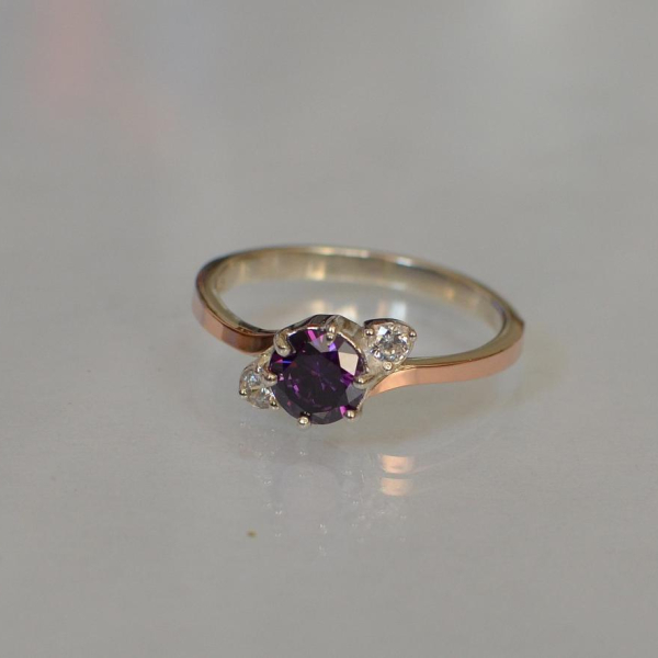 Срібна каблучка з золотими вставками