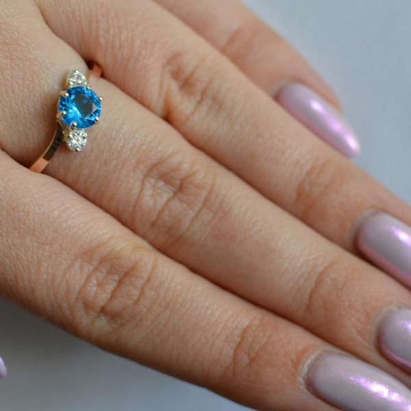 Срібна каблучка з золотими вставками