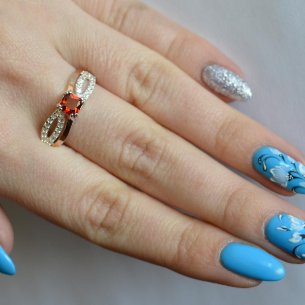 Срібна каблучка з золотими вставками