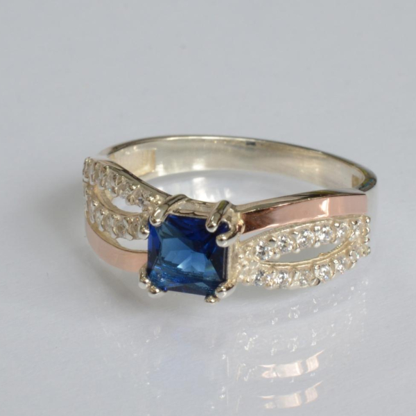 Срібна каблучка з золотими вставками