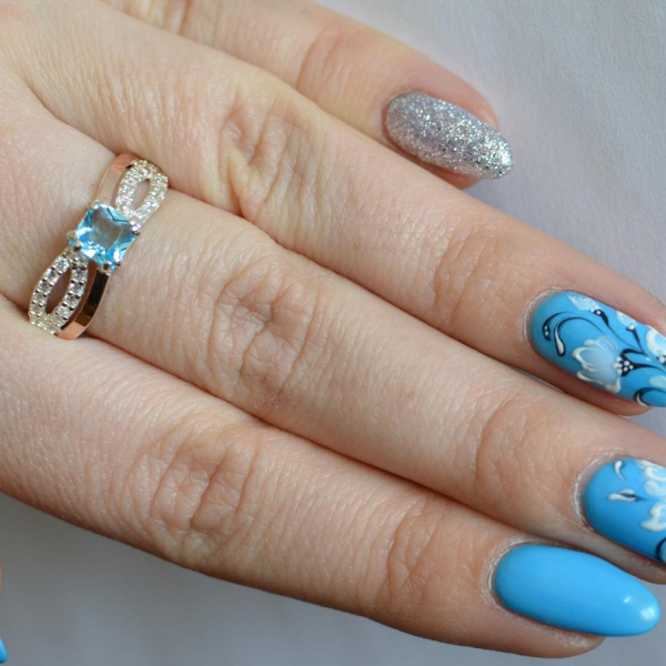 Срібна каблучка з золотими вставками