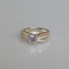 Срібна каблучка з золотими вставками