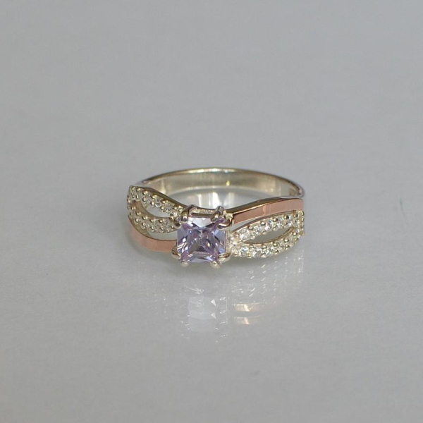 Срібна каблучка з золотими вставками