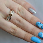 Срібна каблучка з золотими вставками