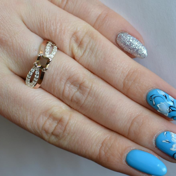 Срібна каблучка з золотими вставками