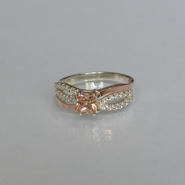 Срібна каблучка з золотими вставками