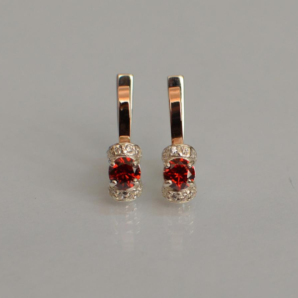 Срібні сережки з золотом