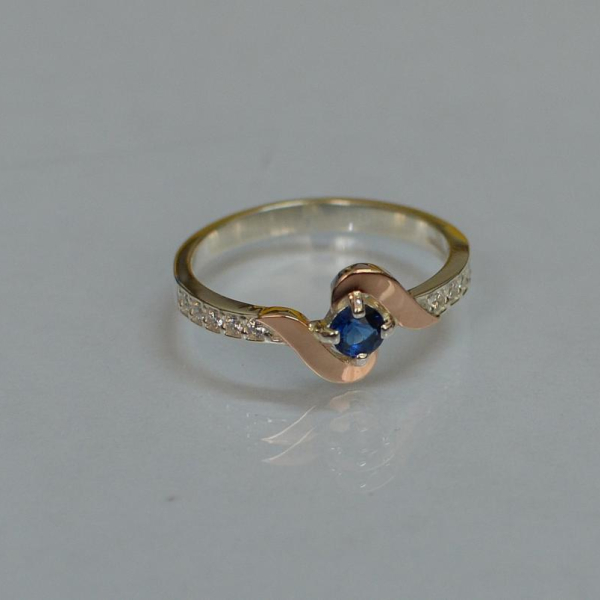 Срібне кільце з золотими вставками