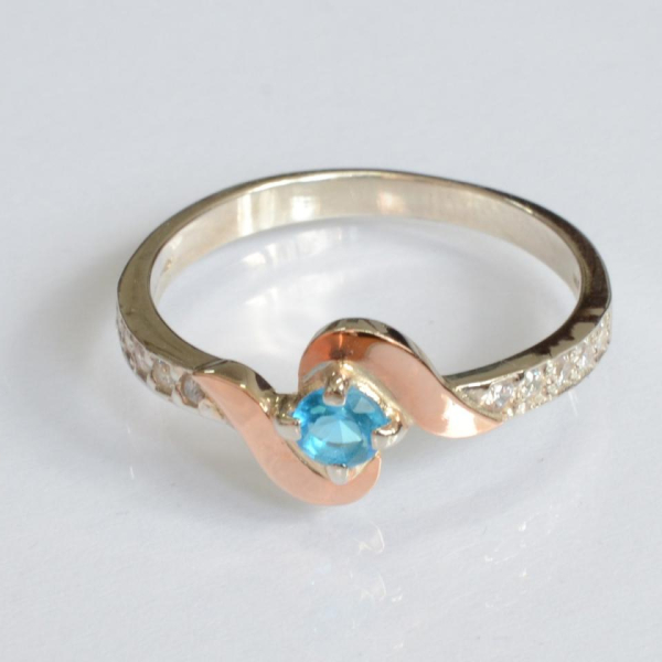 Срібне кільце з золотими вставками