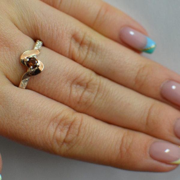 Срібне кільце з золотими вставками