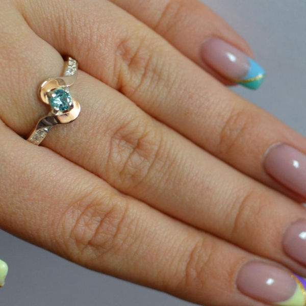 Срібне кільце з золотими вставками