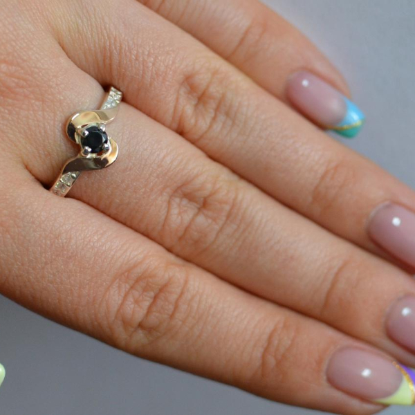 Срібне кільце з золотими вставками