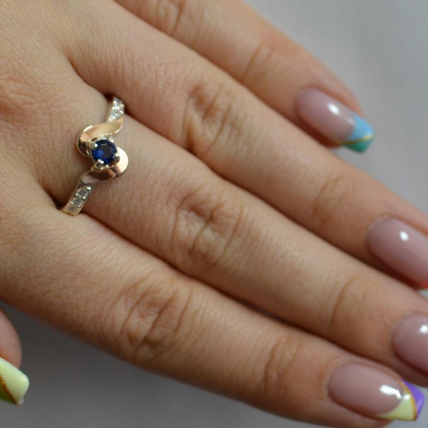 Срібне кільце з золотими вставками