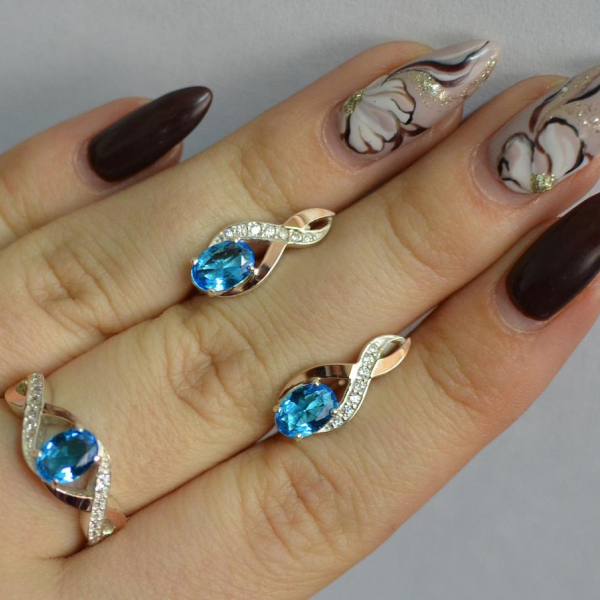 Срібний набір з золотими пластинами