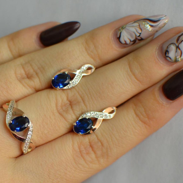 Срібний набір з золотими пластинами