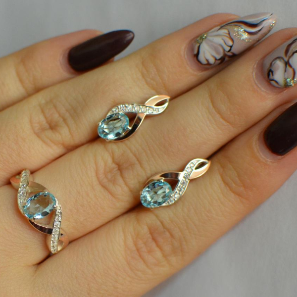 Срібний набір з золотими пластинами