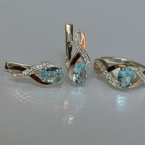 Срібний набір з золотими пластинами