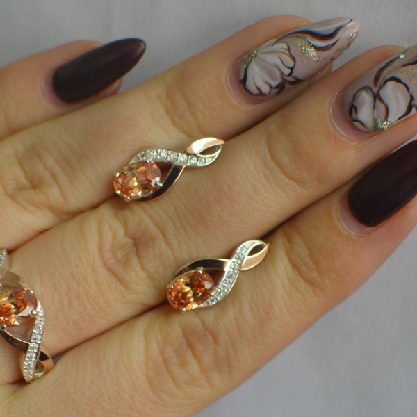 Срібний набір з золотими пластинами