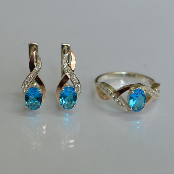 Срібний набір з золотими пластинами