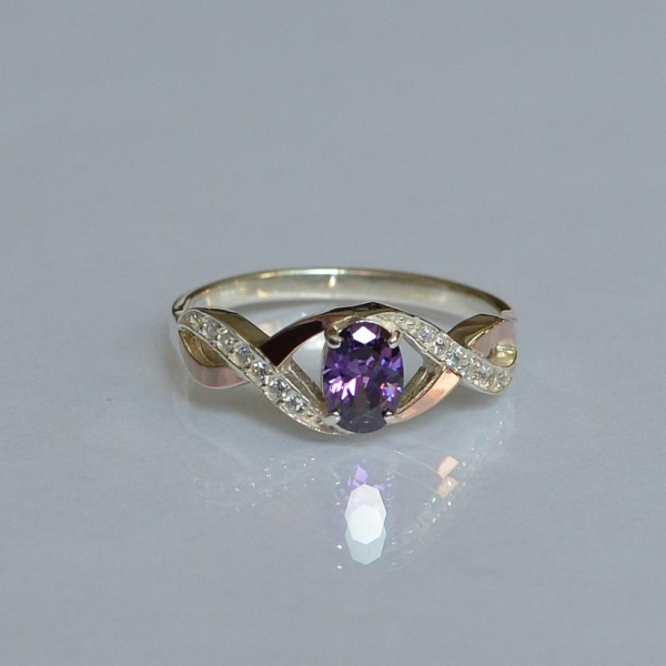 Срібна каблучка з золотими вставками