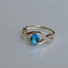 Срібна каблучка з золотими вставками