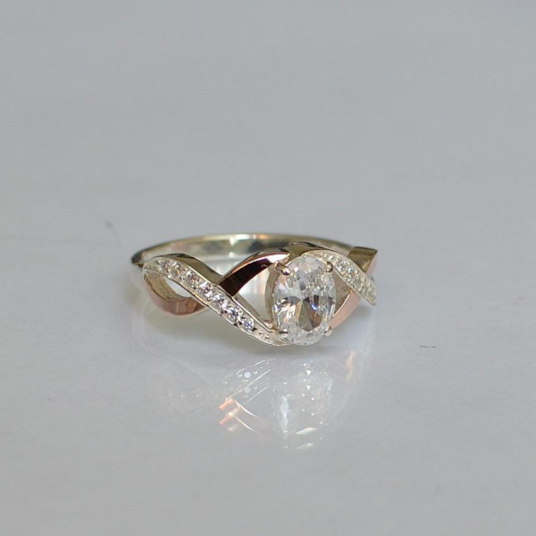 Срібна каблучка з золотими вставками