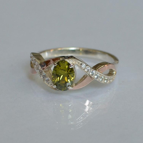 Срібна каблучка з золотими вставками