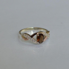 Срібна каблучка з золотими вставками