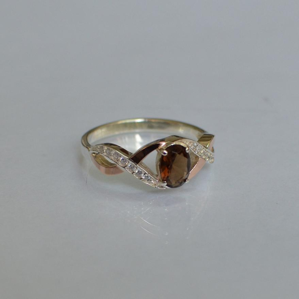 Срібна каблучка з золотими вставками