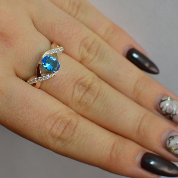 Срібна каблучка з золотими вставками