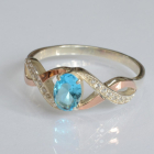 Срібна каблучка з золотими вставками