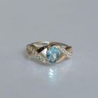 Срібна каблучка з золотими вставками