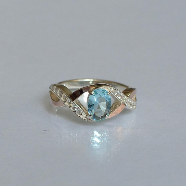 Срібна каблучка з золотими вставками